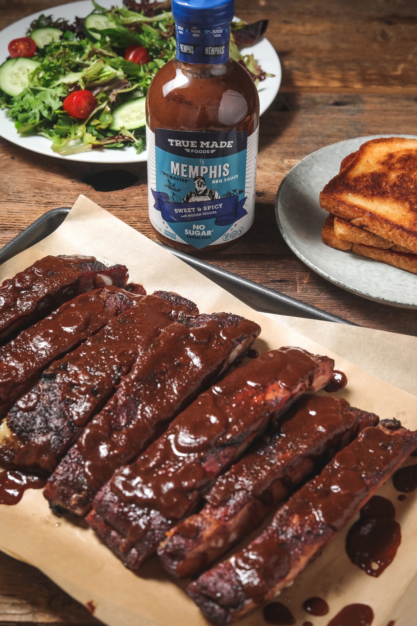 Meat lathered with True Made Foods Memphis BBQ sauce.