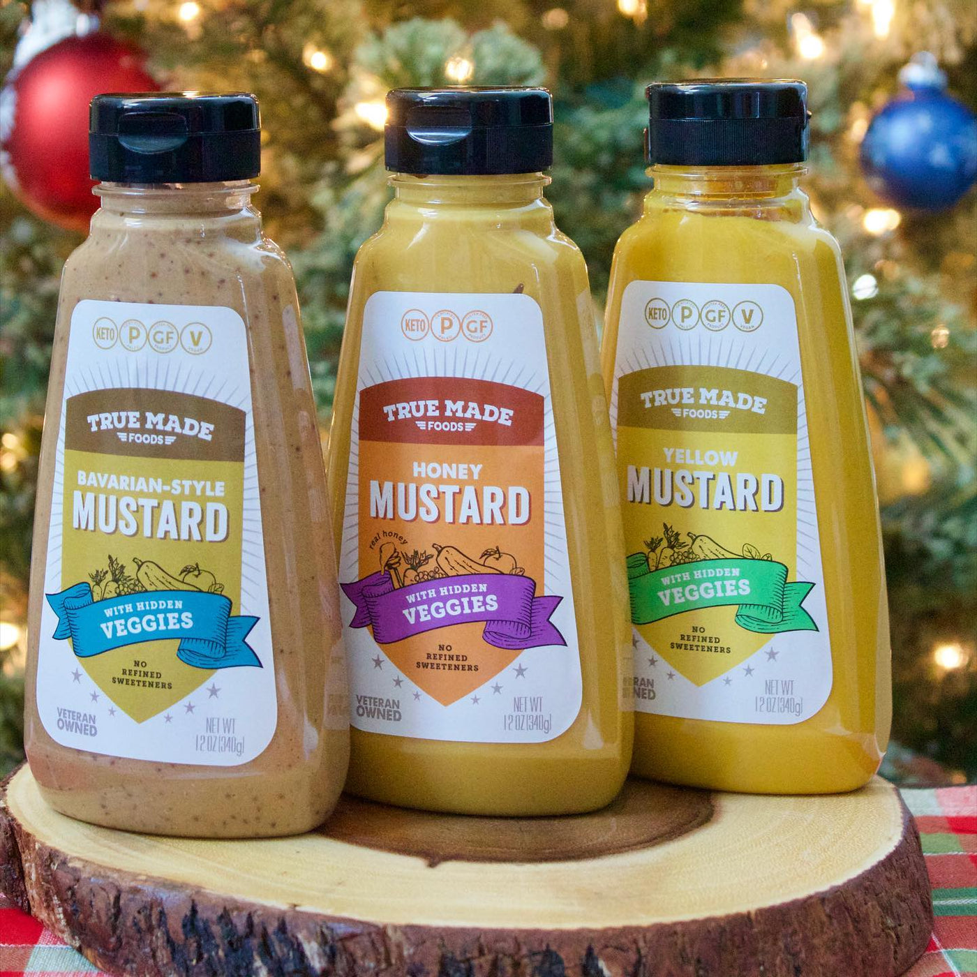 True Made Food’s collection of three clean mustard bottles with zero added sugar.