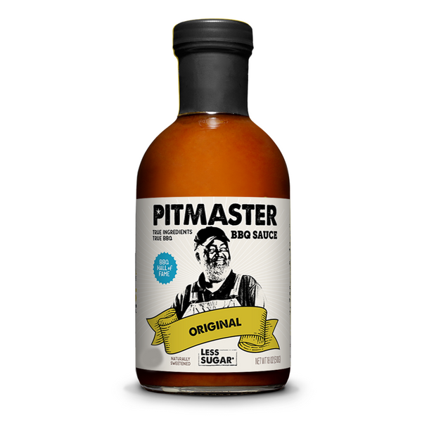 A bottle of Pitmaster BBQ Sauce, Original flavor, with a black cap and a white label featuring a black-and-white illustration of a man and a yellow banner that reads 'Original'. The sauce inside is amber-brown.